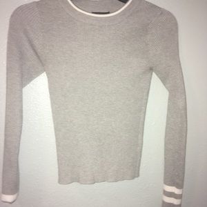 Long sleeve grey and white striped sweater.